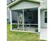 Enjoy the outdoors bug-free with this charming screened in porch featuring a ceiling fan at 528 Ballast Pt, Clayton, NC 27520