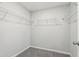 Spacious walk-in closet features built-in shelving for efficient storage at 528 Ballast Pt, Clayton, NC 27520