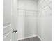 Walk-in closet equipped with white wire shelving, optimizing storage at 528 Ballast Pt, Clayton, NC 27520