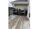 Back deck featuring outdoor seating, a small table, and a relaxing space for enjoying the outdoors at 5430 Neuse Ridge Rd, Raleigh, NC 27610
