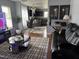 Open-concept living room featuring modern furnishings and decor, connected to the kitchen and dining area at 5430 Neuse Ridge Rd, Raleigh, NC 27610