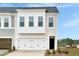 Two-story townhome with attached garage and modern facade at 6 Nettle Ln # 245, Clayton, NC 27520