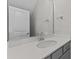 Vanity with quartz countertop and gray cabinets at 607 Marshskip Way, Rolesville, NC 27571