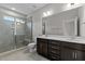Double vanity bathroom with a large glass shower at 607 Marshskip Way, Rolesville, NC 27571