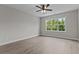 Spacious bedroom with wood-look floors and large window at 607 Marshskip Way, Rolesville, NC 27571