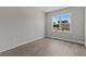 Bright bedroom with wood-look floors and a window at 607 Marshskip Way, Rolesville, NC 27571