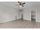Bright bedroom featuring wood-look floors and ample closet space at 607 Marshskip Way, Rolesville, NC 27571