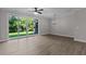 Bright dining room with hardwood floors, sliding glass doors, and chandelier at 607 Marshskip Way, Rolesville, NC 27571