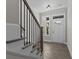 Bright entryway with staircase, hardwood floors, and a view to backyard at 607 Marshskip Way, Rolesville, NC 27571