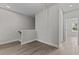 Upstairs hallway with light grey walls and vinyl plank flooring at 607 Marshskip Way, Rolesville, NC 27571