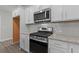 Modern kitchen with stainless steel appliances and granite countertops at 607 Marshskip Way, Rolesville, NC 27571