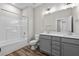 Bathroom with double vanity, bathtub, and toilet at 609 Marshskip Way, Rolesville, NC 27571