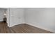 Simple bedroom with double doors and wood-look floors at 609 Marshskip Way, Rolesville, NC 27571