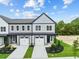 Two-story townhouses with modern finishes and landscaping at 609 Marshskip Way, Rolesville, NC 27571