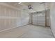 Spacious garage with overhead door and concrete floor at 609 Marshskip Way, Rolesville, NC 27571