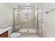 Large walk-in shower with glass enclosure and bench at 609 Marshskip Way, Rolesville, NC 27571