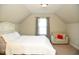 Bright bedroom with a comfortable bed and sitting area at 7713 Stonehenge Farm Ln, Raleigh, NC 27613