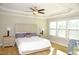 Bright bedroom with hardwood floors and large windows at 7713 Stonehenge Farm Ln, Raleigh, NC 27613