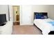 Bedroom with carpet flooring and access to a hallway at 7713 Stonehenge Farm Ln, Raleigh, NC 27613