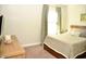 Bedroom with carpet flooring and a large window with curtains at 7713 Stonehenge Farm Ln, Raleigh, NC 27613