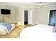 Bright and airy bedroom with hardwood floors and large windows at 7713 Stonehenge Farm Ln, Raleigh, NC 27613