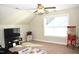 Spacious bonus room featuring a large TV and popcorn machine at 7713 Stonehenge Farm Ln, Raleigh, NC 27613