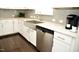 Modern kitchen with farmhouse sink and granite countertops at 7713 Stonehenge Farm Ln, Raleigh, NC 27613