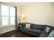 Living area with sectional sofa and large windows at 7713 Stonehenge Farm Ln, Raleigh, NC 27613