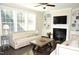 Living room features fireplace, built-ins, and hardwood floors at 7713 Stonehenge Farm Ln, Raleigh, NC 27613