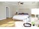 Spacious main bedroom with king-size bed and sitting area at 7713 Stonehenge Farm Ln, Raleigh, NC 27613