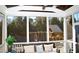 Relaxing screened porch overlooking the backyard with a playset at 7713 Stonehenge Farm Ln, Raleigh, NC 27613