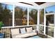 Relaxing screened porch with comfy seating and backyard view at 7713 Stonehenge Farm Ln, Raleigh, NC 27613