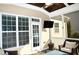 Screened porch with TV and comfy seating at 7713 Stonehenge Farm Ln, Raleigh, NC 27613