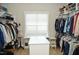 Large walk-in closet with ample hanging space and shelving at 7713 Stonehenge Farm Ln, Raleigh, NC 27613