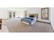 Spacious bedroom with plush carpeting and large windows at 8309 Stryker Ct, Raleigh, NC 27615