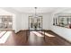 Spacious dining area with hardwood floors and access to backyard at 8309 Stryker Ct, Raleigh, NC 27615