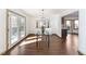 Bright dining room with hardwood floors and glass table at 8309 Stryker Ct, Raleigh, NC 27615