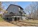 Gray house with a deck and large backyard at 8309 Stryker Ct, Raleigh, NC 27615