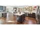 Modern kitchen with island and stainless steel appliances at 8309 Stryker Ct, Raleigh, NC 27615