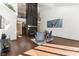 Living room with hardwood floors and a large fireplace at 8309 Stryker Ct, Raleigh, NC 27615