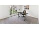 Home office with large windows, desk and comfortable chair at 8309 Stryker Ct, Raleigh, NC 27615