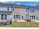 Private backyard with patio and grassy area at 8951 Kennebec Crossing Dr # 51, Angier, NC 27501