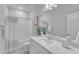 Clean bathroom with shower/tub combo, white vanity, and neutral decor at 8951 Kennebec Crossing Dr # 51, Angier, NC 27501