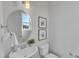 Modern bathroom with white vanity, toilet and oval mirror at 8951 Kennebec Crossing Dr # 51, Angier, NC 27501