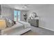 Bedroom featuring a comfortable queen bed and large windows at 8951 Kennebec Crossing Dr # 51, Angier, NC 27501