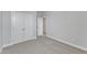 Bright bedroom with double doors and grey carpet at 8951 Kennebec Crossing Dr # 51, Angier, NC 27501