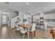 Open concept dining area with wood table and modern chairs at 8951 Kennebec Crossing Dr # 51, Angier, NC 27501
