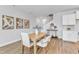 Light-filled dining area with wood table and modern chairs at 8951 Kennebec Crossing Dr # 51, Angier, NC 27501