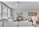 Bright living room with white sectional sofa and access to natural light at 8951 Kennebec Crossing Dr # 51, Angier, NC 27501
