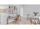 Home office with desk, chair, and artwork. Neutral color palette at 8951 Kennebec Crossing Dr # 51, Angier, NC 27501